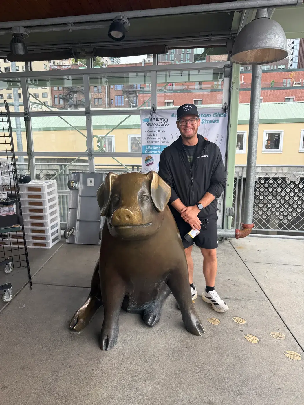 Traveler beside a bronze pig statue