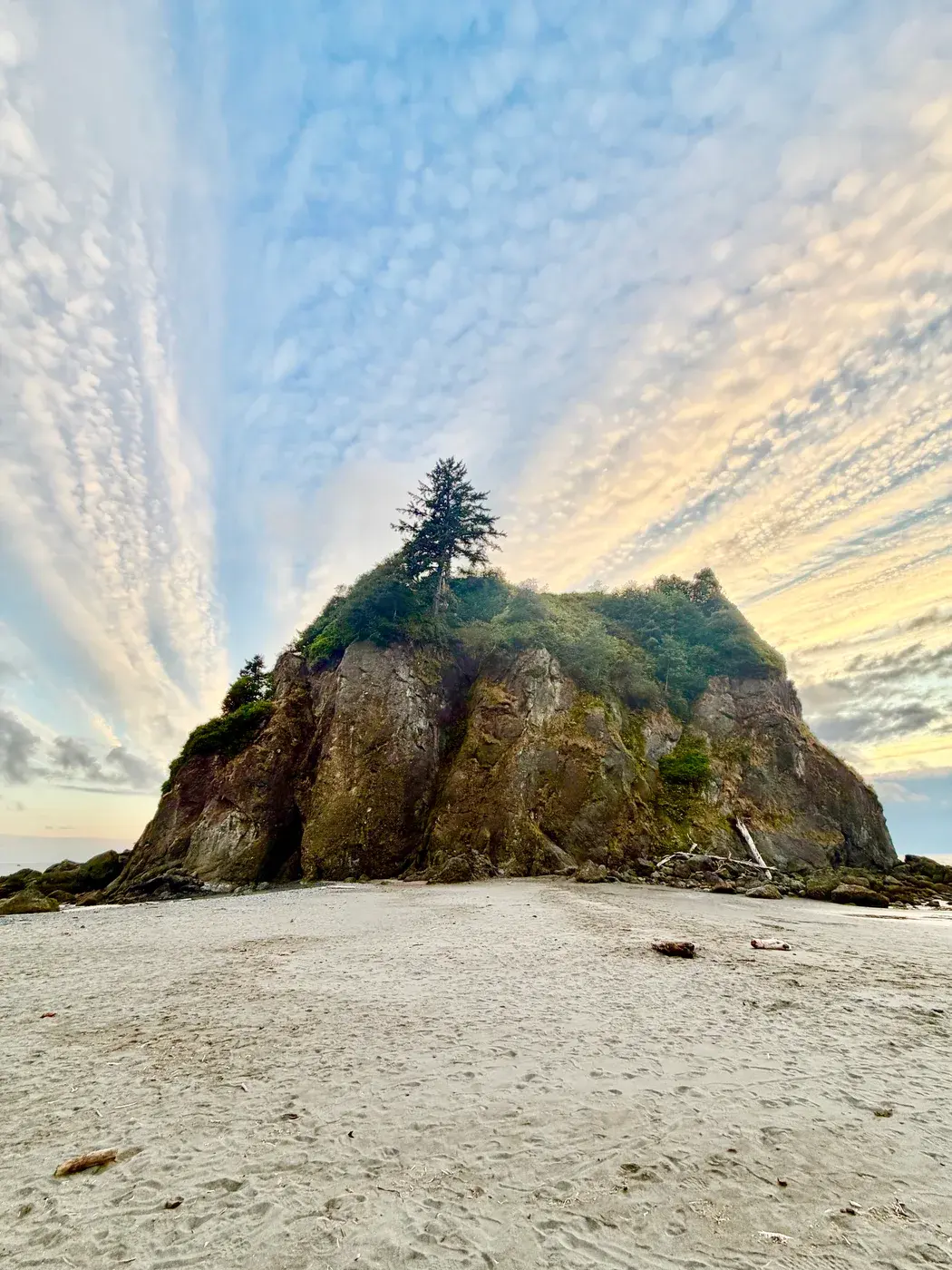A rocky island beneath a dramatic sky
